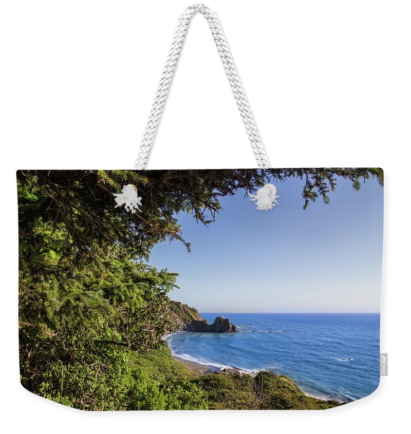 Nickel Creek Campground Weekender Tote Bag featuring the photograph Trees and ocean by Kunal Mehra