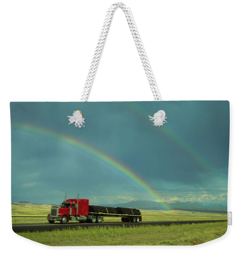 Curve Weekender Tote Bag featuring the photograph Truck With Rainbow Overhead, Blurred by Steve Satushek