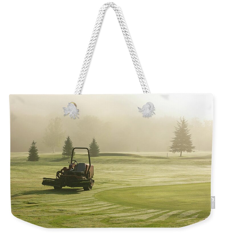 Grass Weekender Tote Bag featuring the photograph Turf Machinery by Cappi Thompson