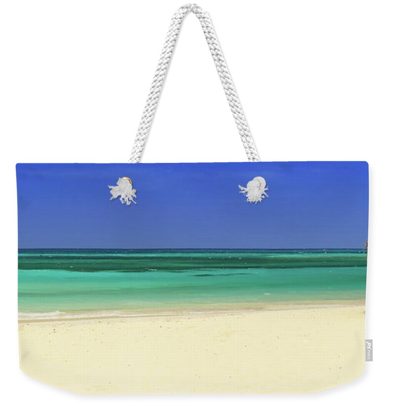 Scenics Weekender Tote Bag featuring the photograph Turquoise Sea With Empty Beach And Palm by Cunfek