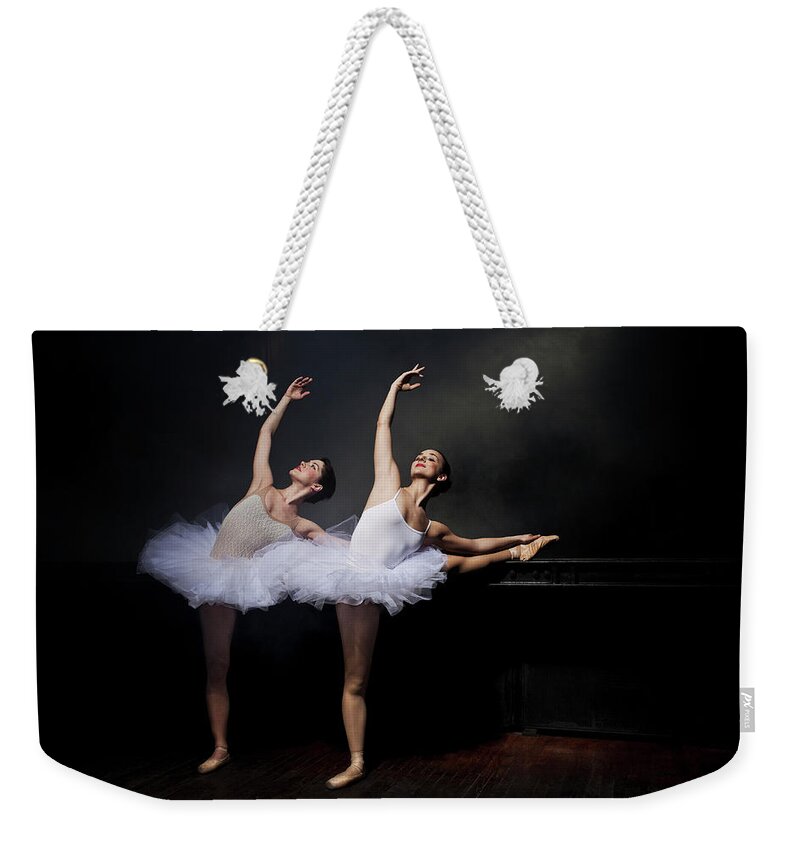Ballet Dancer Weekender Tote Bag featuring the photograph Two Ballet Dancers Stretching by Nisian Hughes