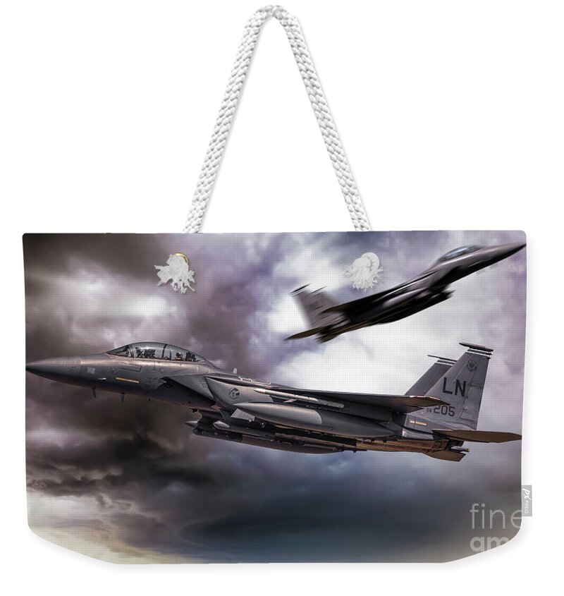 F15 Weekender Tote Bag featuring the digital art Two F-15E Strike Eagle passing in storm clouds by Simon Bratt
