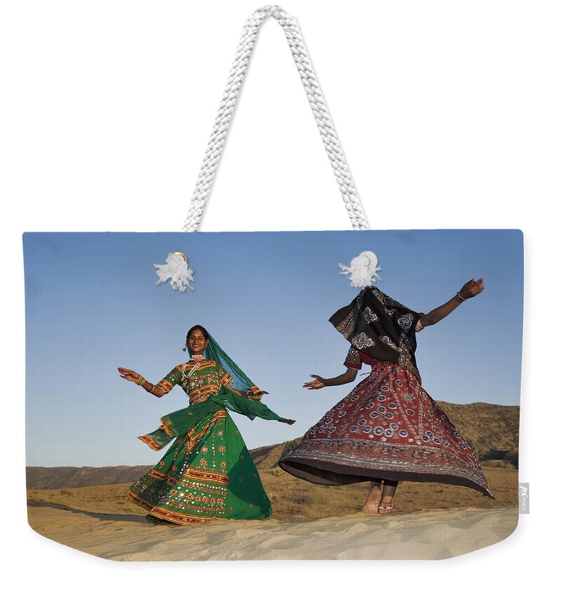 People Weekender Tote Bag featuring the photograph Two Young Indian Women In A Beautifully by Martin Harvey