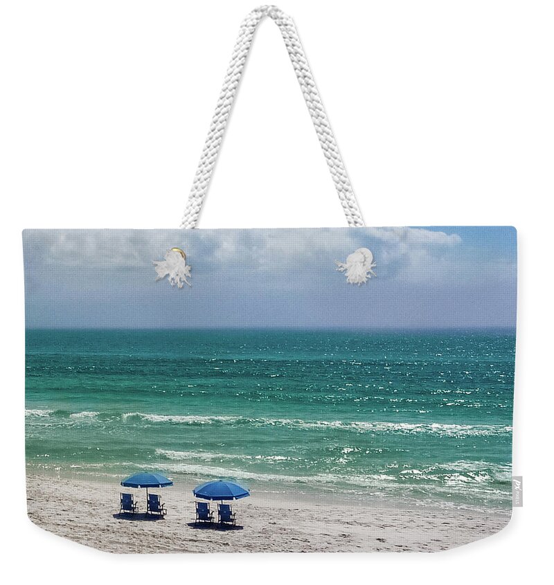 Seaside Weekender Tote Bag featuring the photograph Umbrellas at Sea by Joe Kopp