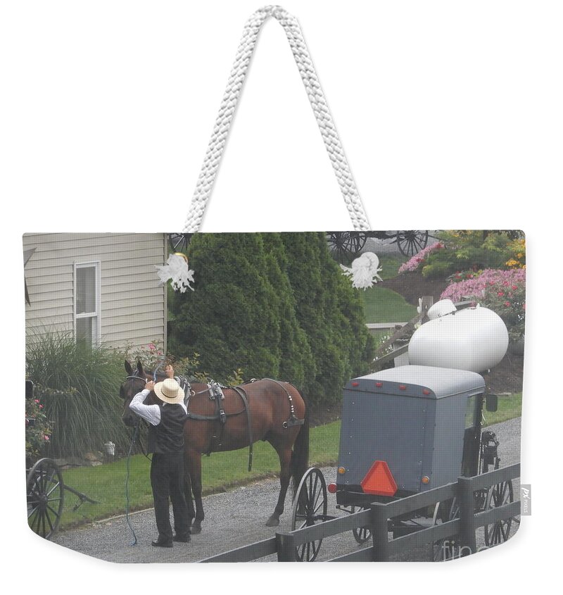 Amish Weekender Tote Bag featuring the photograph Unhitching the Horse on a Sunday by Christine Clark