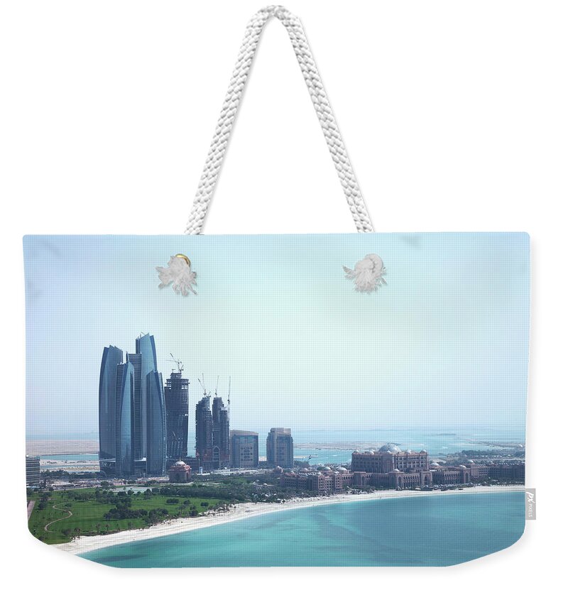 Outdoors Weekender Tote Bag featuring the photograph Urban Skyline By Tropical Beach by Cultura Exclusive/lost Horizon Images