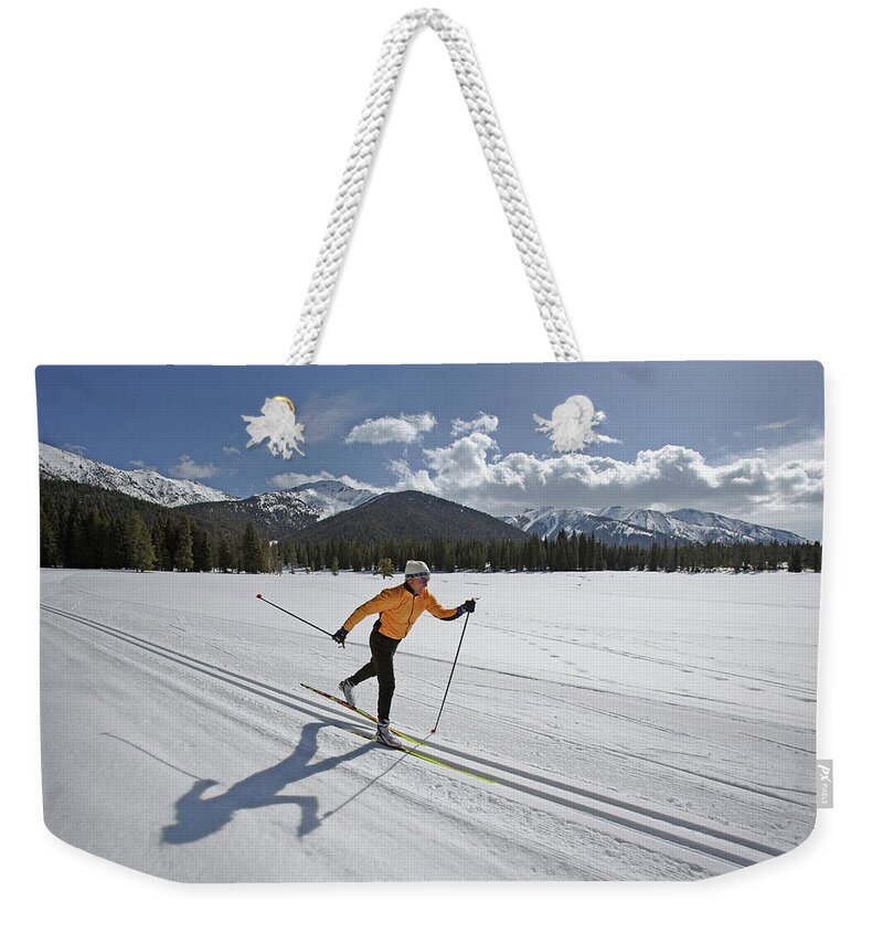 Ski Pole Weekender Tote Bag featuring the photograph Usa, Sun Valley, Idaho, Mature Man by Karl Weatherly