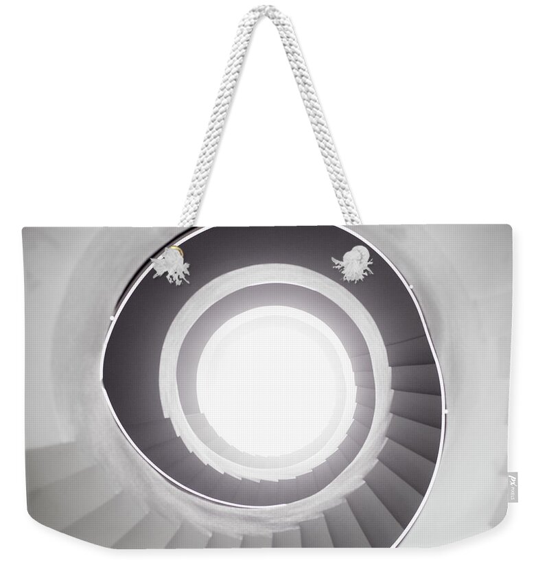 Directly Below Weekender Tote Bag featuring the photograph View From Bottom Of Spiral Staircase by Tim Robberts