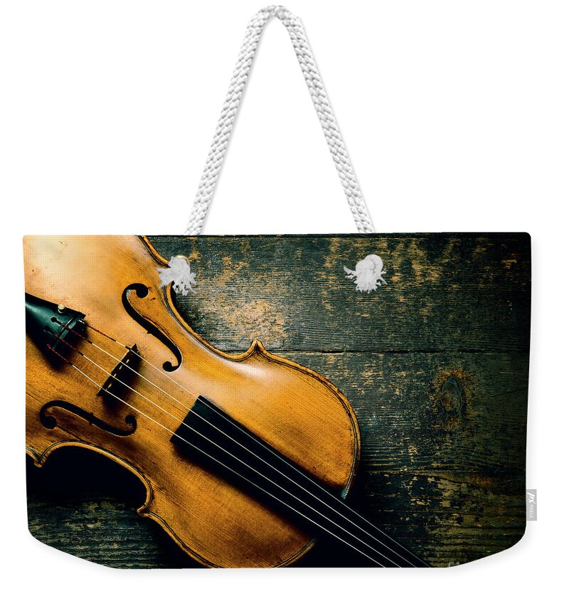 Violin Weekender Tote Bag featuring the photograph Violin on textured background by Jelena Jovanovic