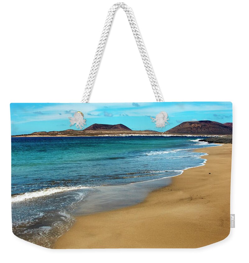 Tranquility Weekender Tote Bag featuring the photograph Water Caresses Sand by Andreas Weibel - Www.imediafoto.com