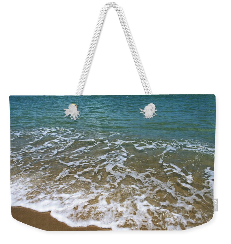 Water's Edge Weekender Tote Bag featuring the photograph Waves Washing Onto White Sandy Beach by Luis Veiga