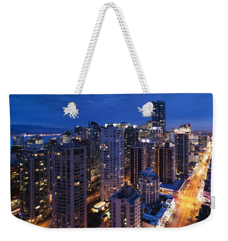 Outdoors Weekender Tote Bag featuring the photograph West End Buildings Along Robson Street by Walter Bibikow