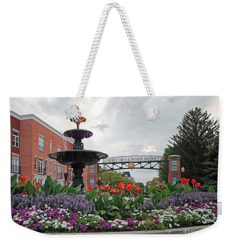 Carmel Weekender Tote Bag featuring the photograph Western Gateway to Carmel, Indiana Arts and Design District by Steve Gass