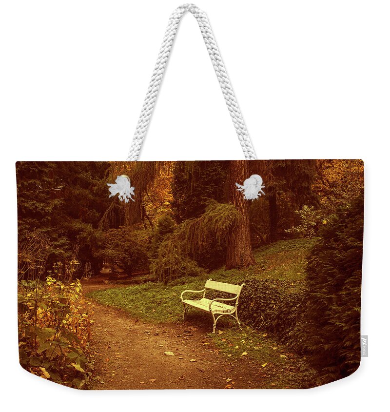 Jenny Rainbow Fine Art Photography Weekender Tote Bag featuring the photograph White Bench in Secret Garden 1 by Jenny Rainbow