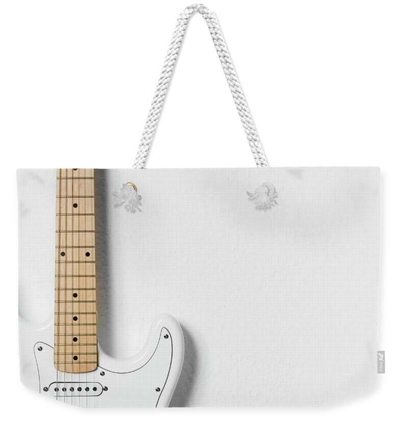 White Background Weekender Tote Bag featuring the photograph White Electric Guitar by Stock4b Creative