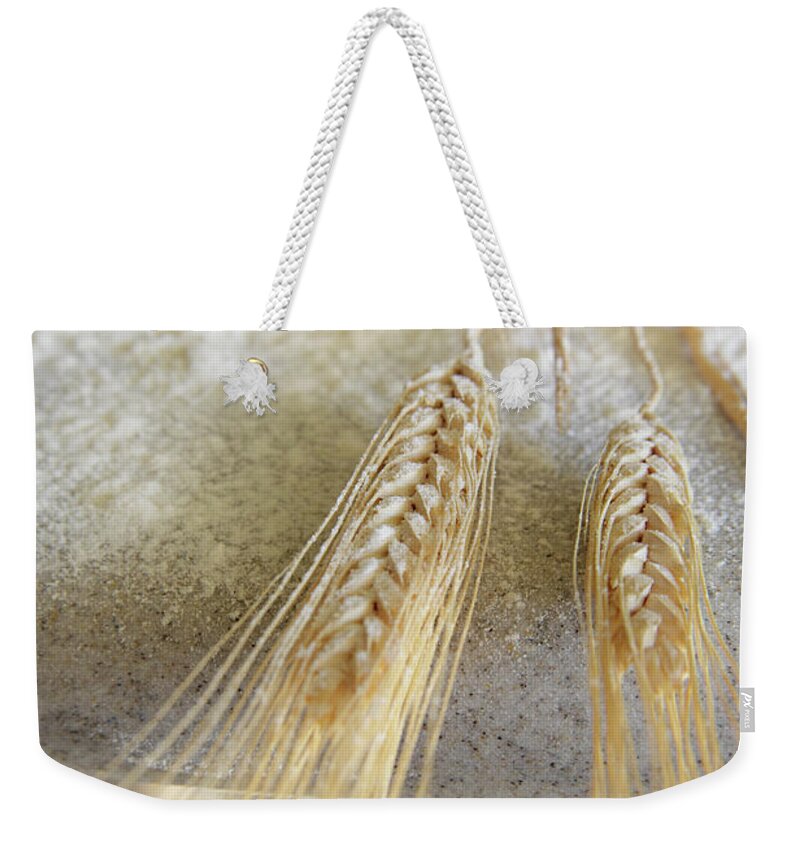 Kitchen Weekender Tote Bag featuring the photograph Whole Wheat Dusted With Flour On by Steve Cicero