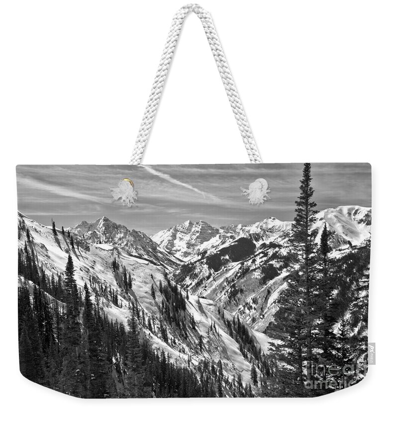 Maroon Bells Weekender Tote Bag featuring the photograph Winter Bells Through The Trees Black And White by Adam Jewell