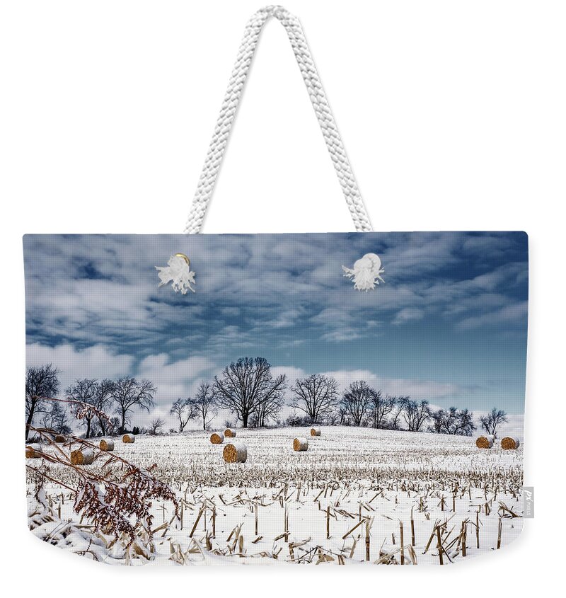 Corn Snow Weed Trees Farm Stubble Hay Field Farming Agriculture Winter Frozen Landscape Sky Serene Peaceful Cold Stoughton Wi Dane County Wisconsin Land Weekender Tote Bag featuring the photograph Winter Blues and Bales - snow covered corn stubble and bales near Stoughton WI by Peter Herman
