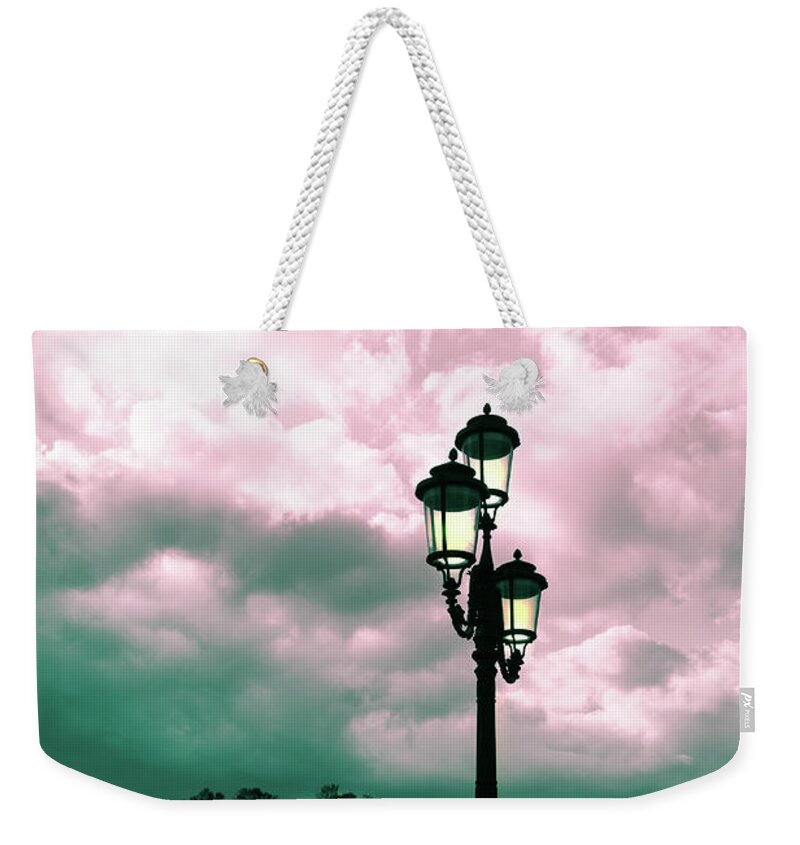 Toned Weekender Tote Bag featuring the photograph Winter Venice lantern on the embankment by Marina Usmanskaya