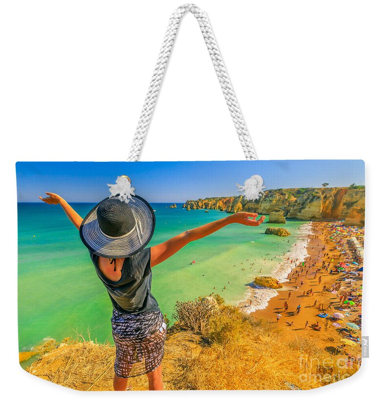 Portugal Weekender Tote Bag featuring the photograph Woman in Algarve Coast by Benny Marty