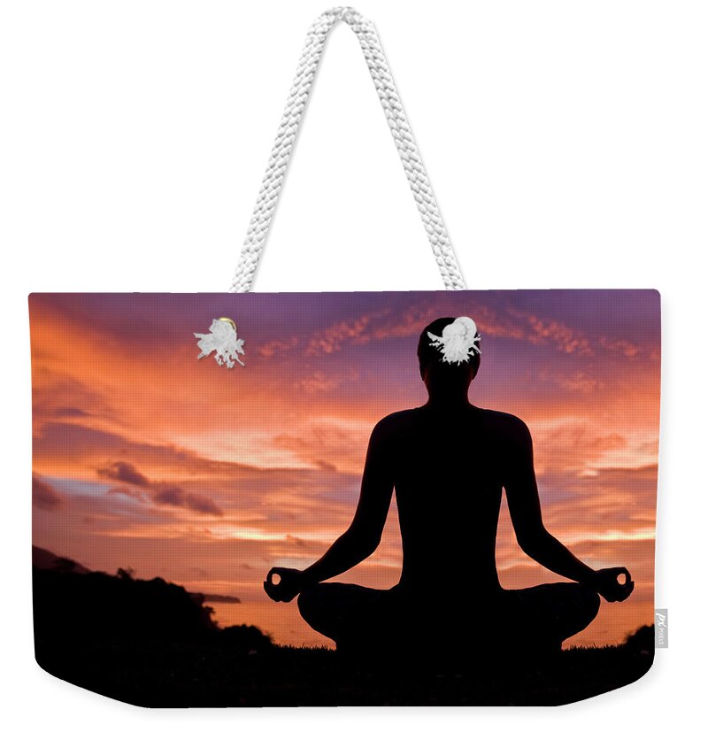 People Weekender Tote Bag featuring the photograph Woman Meditating In Sunset by Aleaimage