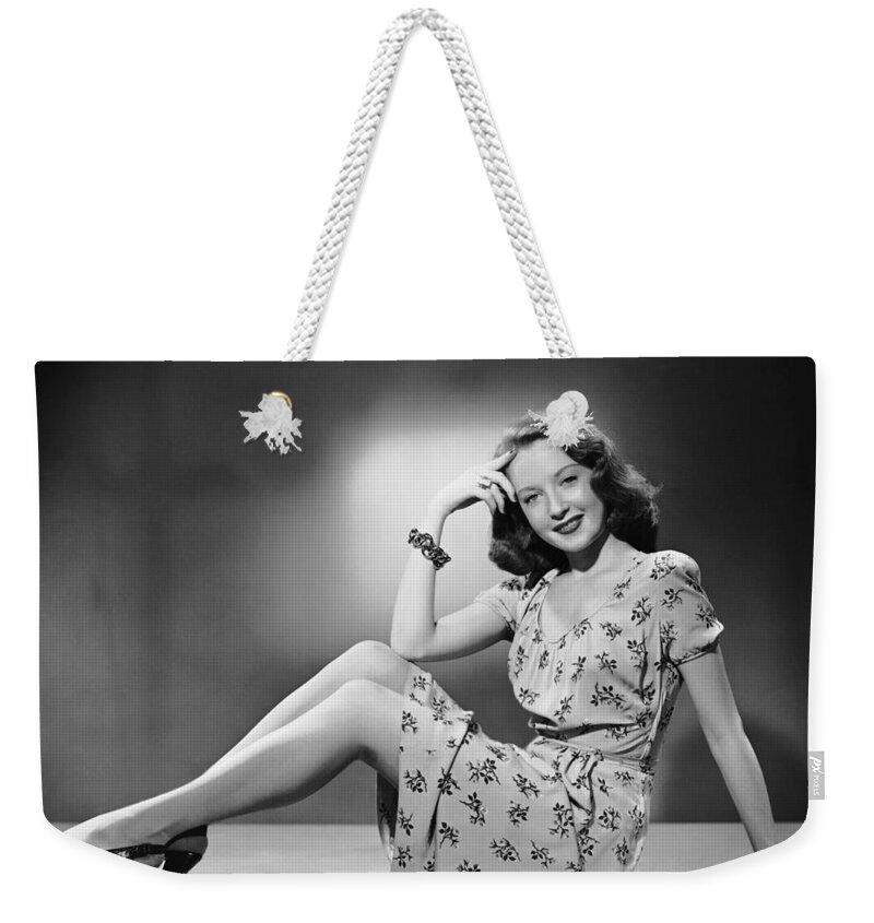 People Weekender Tote Bag featuring the photograph Woman Sitting On Table Top by George Marks