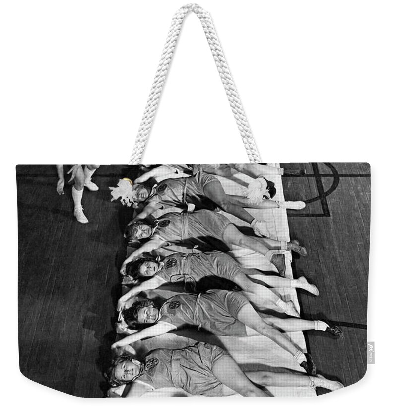 1920s Weekender Tote Bag featuring the photograph Women Exercising Lesson by Underwood Archives
