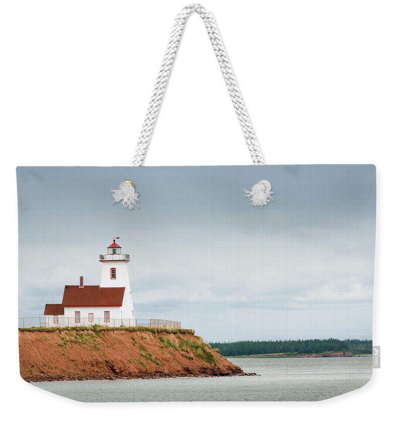 Water's Edge Weekender Tote Bag featuring the photograph Wood Islands Lighthouse by Westhoff