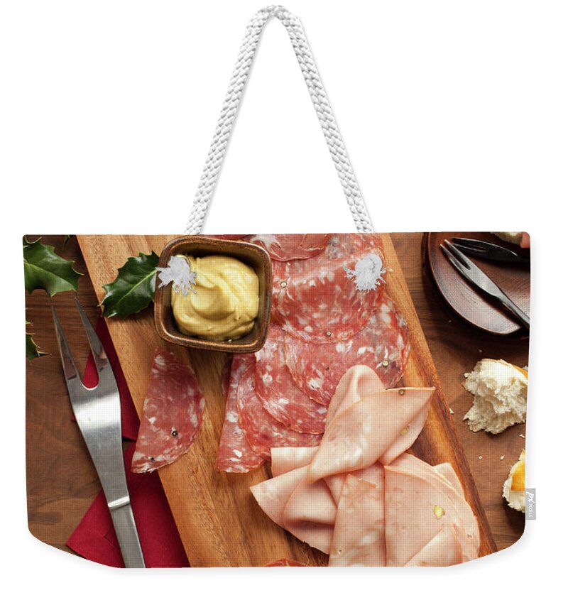 California Weekender Tote Bag featuring the photograph Wooden Platter With Sliced Deli Meats by Lisa Romerein