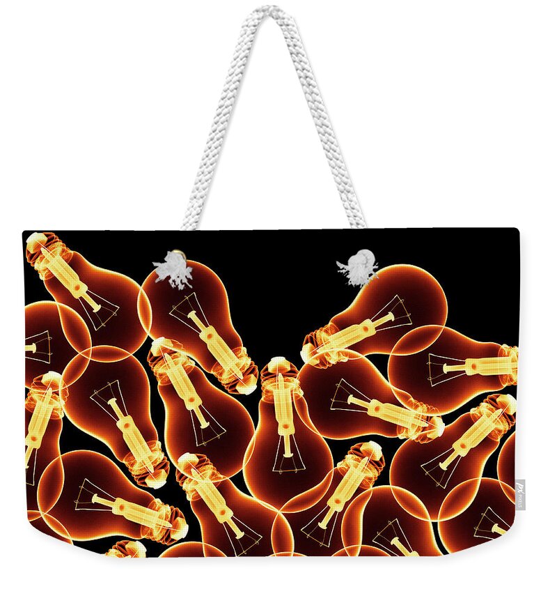 Black Background Weekender Tote Bag featuring the photograph X-ray Of Lightbulbs, Digital Composite by Peter Dazeley