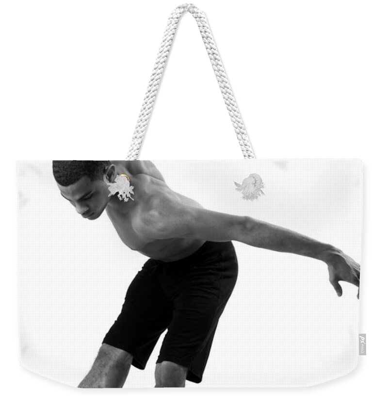Human Arm Weekender Tote Bag featuring the photograph Young Male In Dancer Position by Michael Rowe