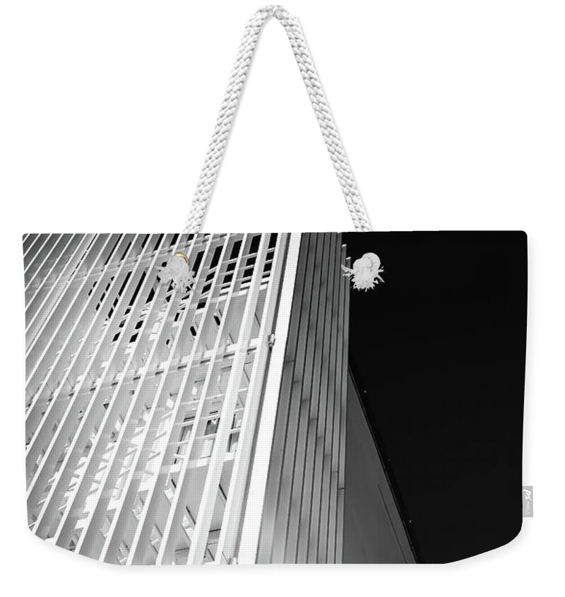 Architecture Weekender Tote Bag featuring the photograph Abstract architecture design. Black and white futuristic exterior background. Black sky copy-space by Michalakis Ppalis