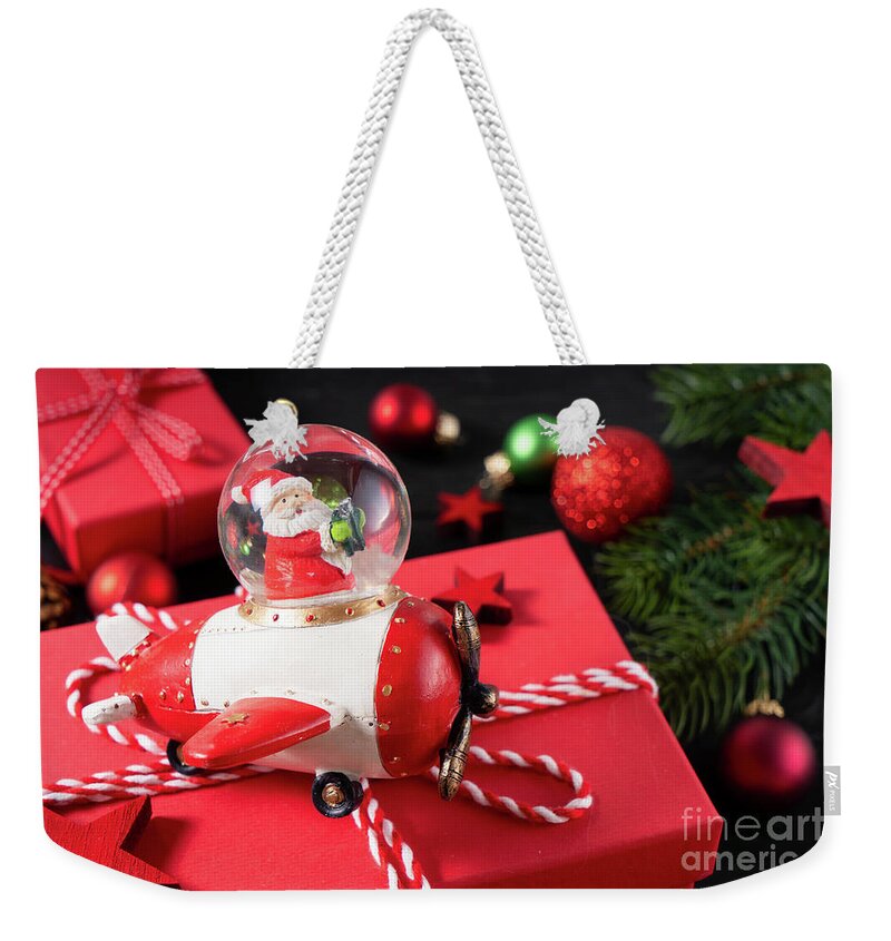 Christmas Weekender Tote Bag featuring the photograph Christmas flat lay scene with golden decorations #1 by Anastasy Yarmolovich