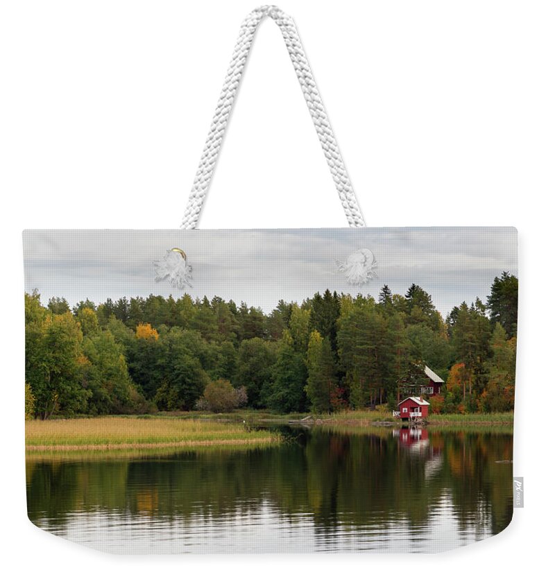Kuopio Weekender Tote Bag featuring the photograph Country house in the forest in the lake. Autumn season Kuopio Finland #1 by Michalakis Ppalis
