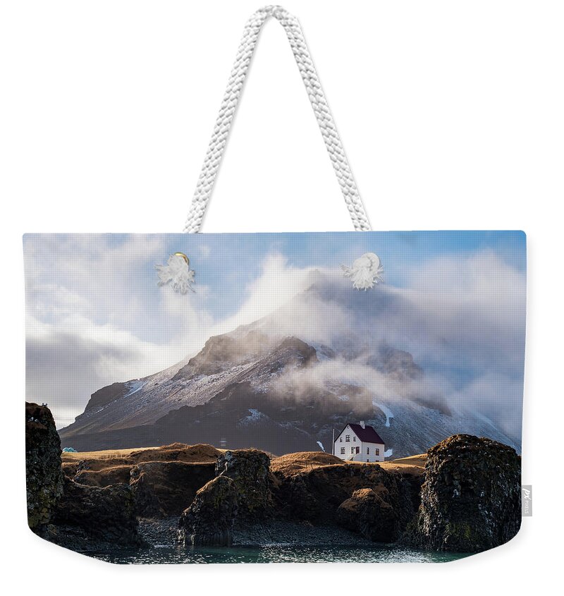 Arnarstapi Weekender Tote Bag featuring the photograph Iceland landscape in winter at Arnarstapi village. by Michalakis Ppalis