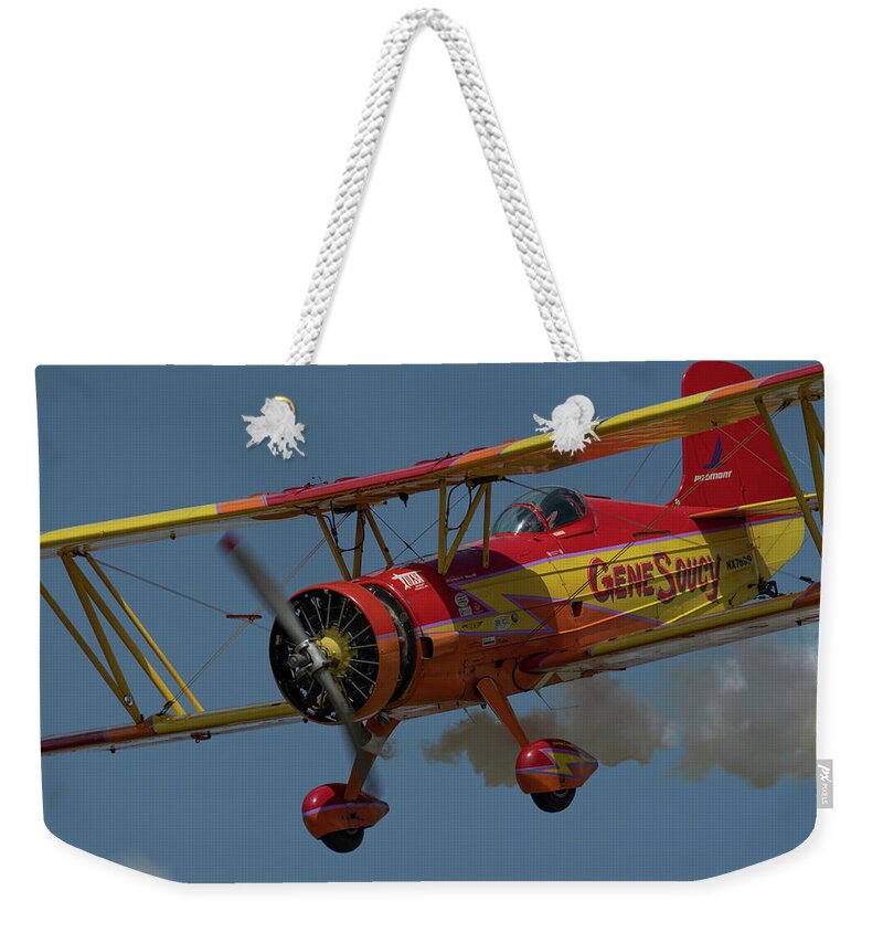 Red Weekender Tote Bag featuring the photograph Red and Yellow Airplane by Carolyn Hutchins