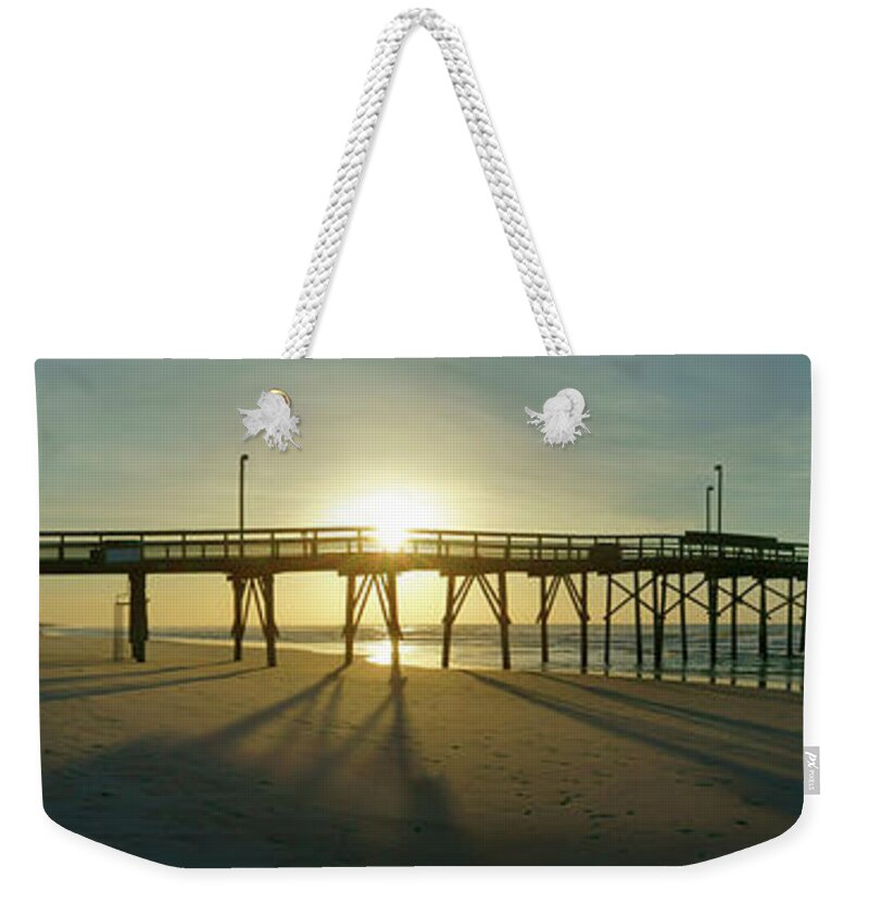 Beach Scene Weekender Tote Bag featuring the photograph Sunrise at the Jolly Roger Pier by Mike McGlothlen