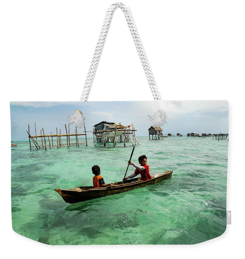 Sea Weekender Tote Bag featuring the photograph Neptune's Children - Sea Gypsy Village, Sabah. Malaysian Borneo by Earth And Spirit