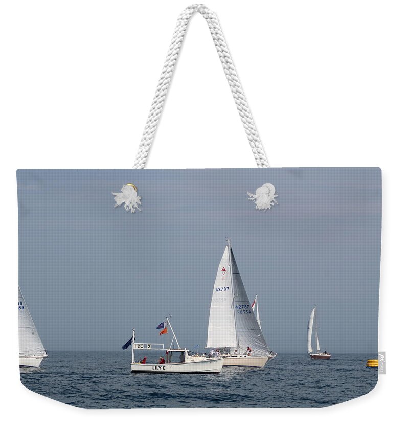  Weekender Tote Bag featuring the photograph The race #145 by Jean Wolfrum