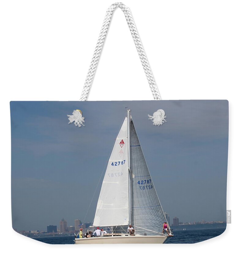  Weekender Tote Bag featuring the photograph The race #15 by Jean Wolfrum