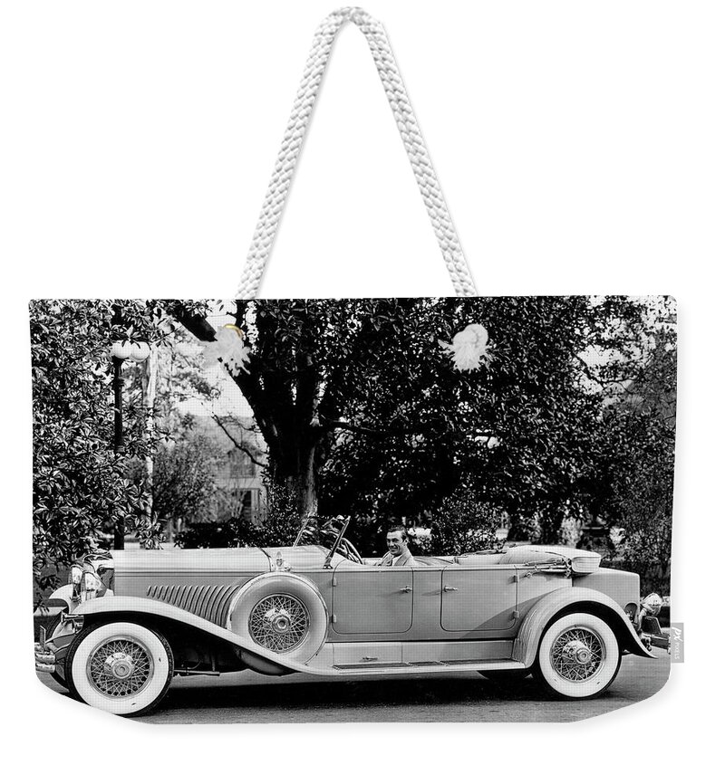Duesenberg Weekender Tote Bag featuring the photograph 1930 Duesenberg with actor Gary Cooper by Retrographs