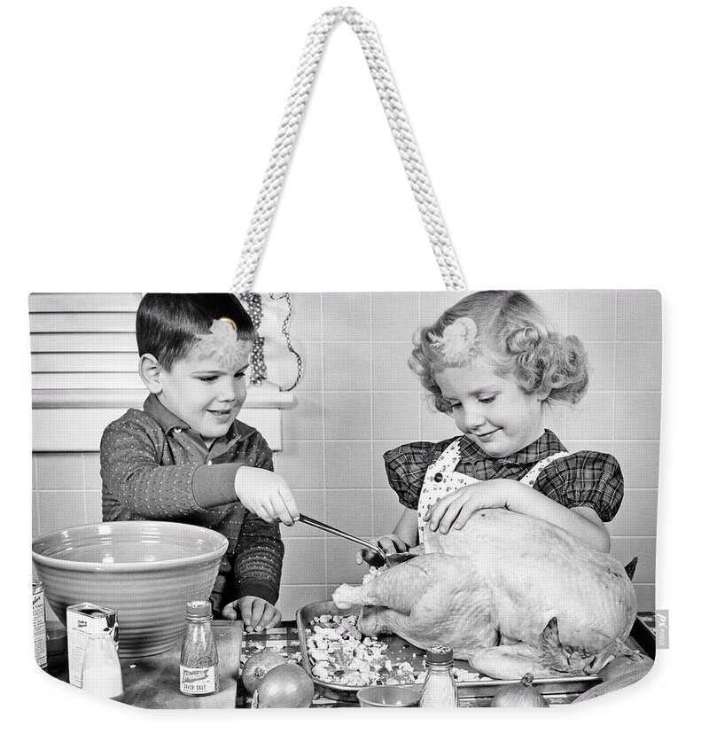 https://render.fineartamerica.com/images/rendered/default/flat/weekender-tote-bag/images/artworkimages/medium/3/1950s-smiling-boy-and-girl-brother-and-older-sister-ladling-bread-stuffing-into-thanksgiving-turkey-panoramic-images.jpg?&targetx=0&targety=-58&imagewidth=779&imageheight=623&modelwidth=779&modelheight=506&backgroundcolor=989699&orientation=0&producttype=totebagweekender-24-16-white