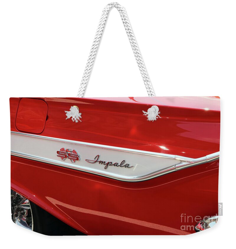 1961 Weekender Tote Bag featuring the photograph 1961 Chevy Impala SS 2 Door Hardtop Emblem 9700 by Jack Schultz