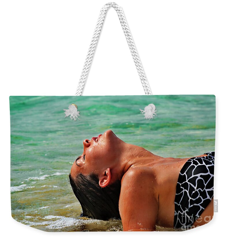 Woman Weekender Tote Bag featuring the photograph Beautiful woman in the sea #2 by Jelena Jovanovic