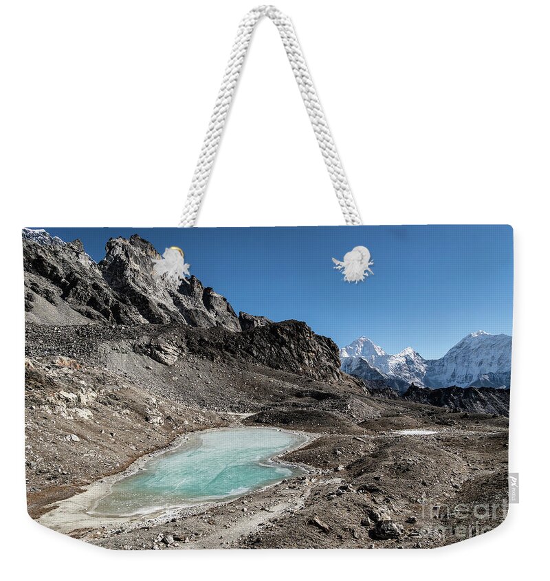 Asia Weekender Tote Bag featuring the photograph Frozen lake at the top of the Kongma La pass, liking the Chukung #2 by Didier Marti