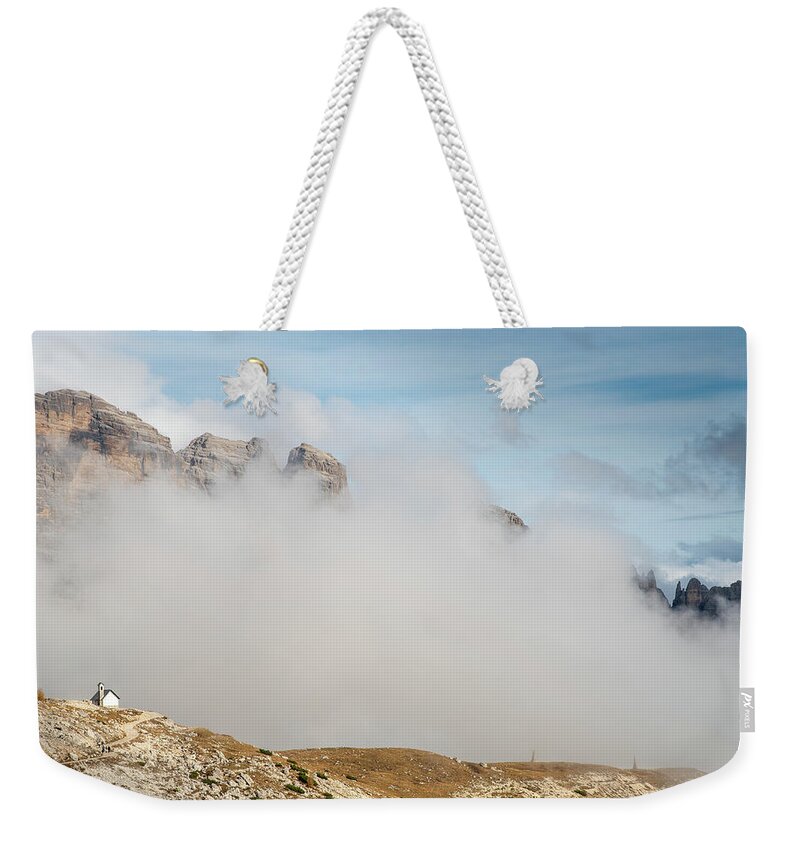 Tre Cime Weekender Tote Bag featuring the photograph Mountain landscape with fog in autumn. Tre Cime dolomiti Italy. by Michalakis Ppalis