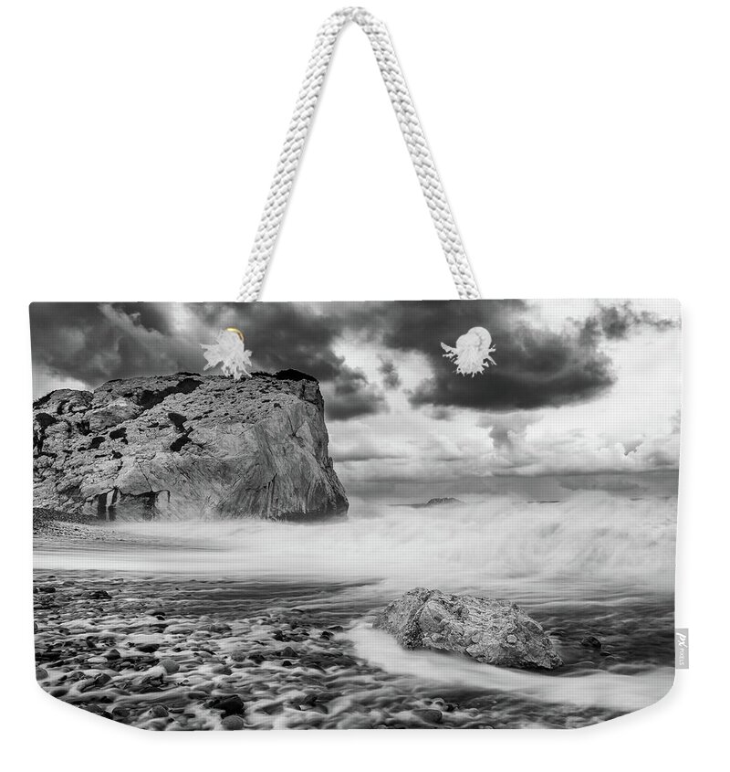 Seascape Weekender Tote Bag featuring the photograph Seascape with windy waves during stormy weather. by Michalakis Ppalis