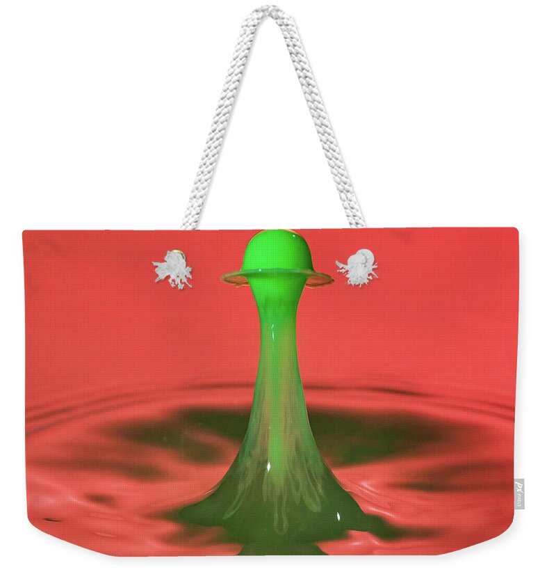 Waterdrop Weekender Tote Bag featuring the photograph Water drop falling onto column of water #3 by Steven Heap