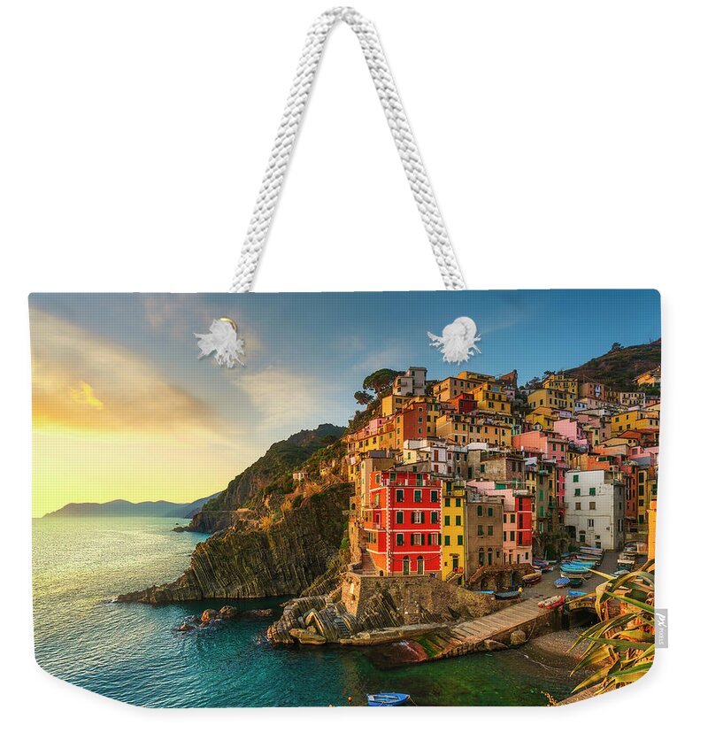 Riomaggiore Weekender Tote Bag featuring the photograph Riomaggiore town, cape and sea landscape at sunset. Cinque Terre #4 by Stefano Orazzini
