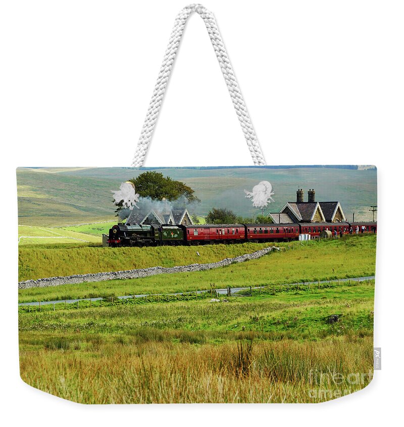 Steam Weekender Tote Bag featuring the photograph 46115 Scots Guardsman at Ribblehead station. by David Birchall